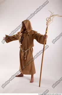 02 2019 01 JOEL ADAMSON MONK STANDING POSE WITH A…